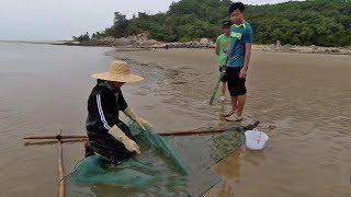 A fisher girl stretches her nets by the sea again and sees that the goods are constantly