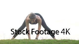 Girl performs yoga in park