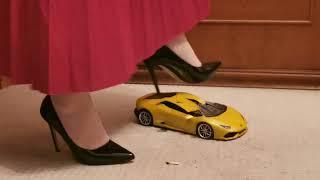 Brand new remote control car destroyed under black stilettos