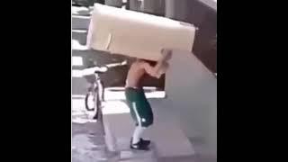 Crackhead rides bike while carrying a fridge