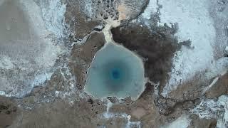 Geysir Geothermal Area. Strokkur Icelands only active geyser. 4K Drone.