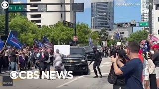 Protester detained after rushing Trumps motorcade outside Miami courthouse