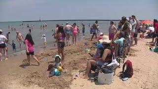 Beachgoers take advantage of summer weather on Fathers Day