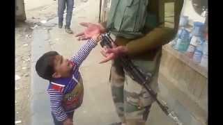 Kashmiri kid tries to snatch Indian cops weapon Funny
