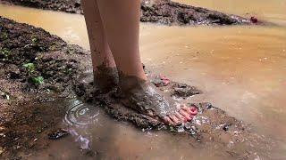 Aliona walking barefoot through deep mud and smelly puddles barefoot in mud muddy feet # 1348