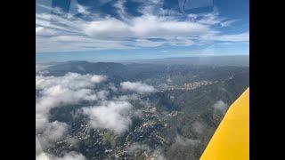 Flight through Dtown LA Hollywood Hills and Malibu clouds