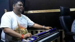 Dhananjay Mishra jifamous music director of Indiaplaying Banjo in a Recording..