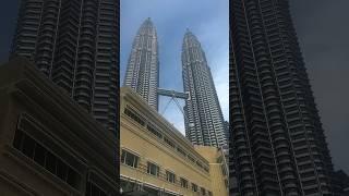 When you finally make it to the iconic Petronas Towers #kualalumpur #malaysia #travelcouple