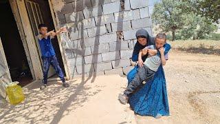 Nomadic grandmother making soup for her daughters children