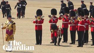 Soldier faints during trooping the colour rehearsal in London heatwave