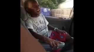 Kid laughing in a car meme template