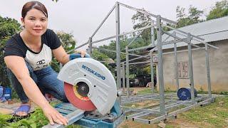 The girl completed the house frame preparing to build a house floating on the water.