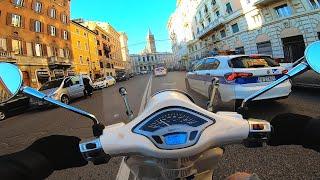 Vespa cruising in Rome Italy