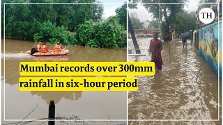 Mumbai rains Heavy rain lashes Mumbai train services affected