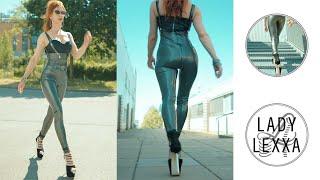 WALKING IN LATEX CATSUIT AND EXTREMELY HIGH HEELS