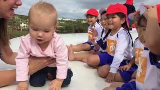 Adorable Japanese children meet cute American baby