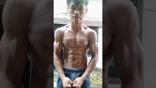 muscular Indonesian teen showing his muscles 