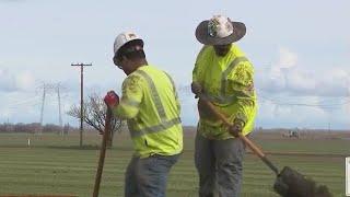 Outdoor workers try to stay cool in triple-digit heat