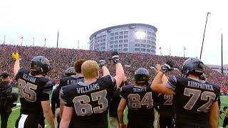 Fans Players in University of Iowa Stadium Turn to Wave at Kids in Hospital