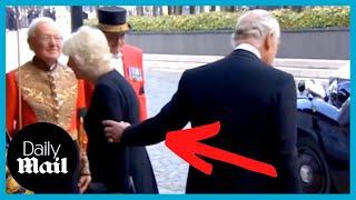 King Charles III taps Camillas arm ushering her away