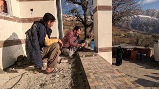 Nomadic Construction Cementing the Floor and Roofing the Wooden Hut