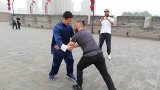 Random tourists interacts with Chinese Kungfu Yiquan master