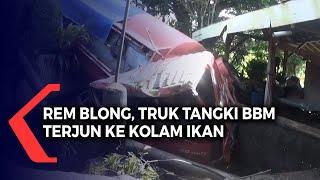 Rem Blong Truk Tangki BBM Terjun ke Kolam Ikan