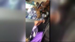 Video shows woman restrain small child sit on him in school bus struggle