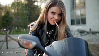 Biker girl Kate is smoking 100mm cigarette and posing for us