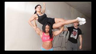 Female Bodybuilder Kashma Maharaj Lifting another girl above head