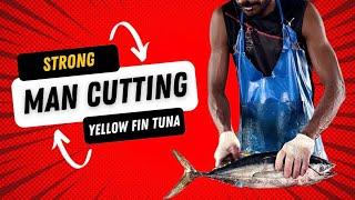 Strong man cutting 3 yellow fin tuna smoothly