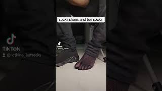 Male feet in toe socks and socks shoes toe wiggle in shoes