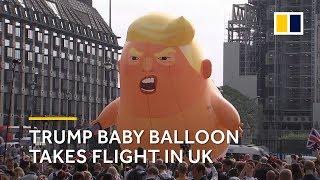 UK protesters mock Trump with orange baby blimp