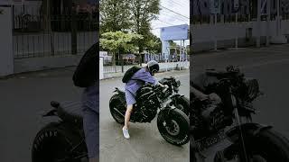 cool girl riding cafe racer