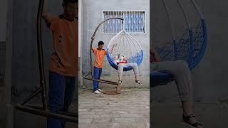 With patience you too can learn to support the boy on the hanging chair