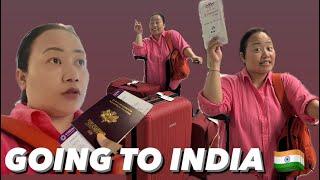 Going to India in pink shirt orange bag and omg RED SUITCASES  NYONPA RAY JHEY