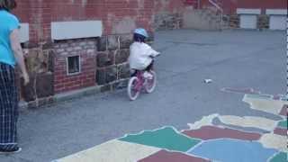 Maggie Riding Her Bike No Wheels.AVI