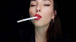 A closeup shot of smoking Marlboro Gold  cigarette with bright red lipstick on  Miss Sara