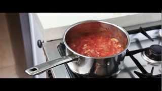Funny chef makes pizza sauce like a boss
