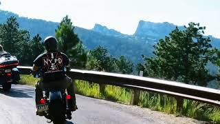 Mount Rushmore pass by on Harley Davidson.. needles highway