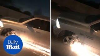 Sparks fly as driver cruises down highway on tire rim