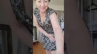 Beautiful mature woman prepares for bikini haul swimsuit try on