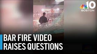 Video of man inside burning bar raises questions