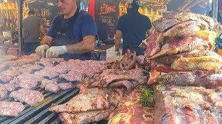 Grilled Meat Roasted Texas Style. Juicy Pork Loin Ribs and more. Street Food Fair in Italy