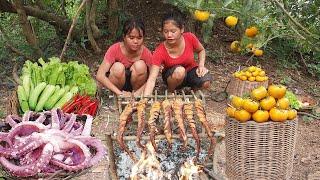 Pick wild Persimmon fruit and Octopus arm hot red chili roasted for diner Eating delicious