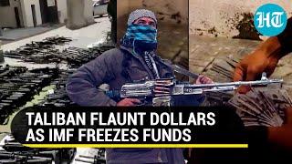 Watch Taliban flaunt weapons dollars after US IMF freeze funds amidst Afghan turmoil