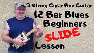How to play a 3 string Cigar Box Guitar - Beginner slide lesson 12 Bar Blues