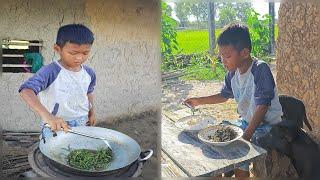 Adorable countryside boy cook food  Rural life village of little chef Heng