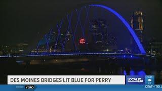 Des Moines bridges lit blue in support of Perry Iowa
