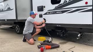 RV campground setup procedures for water sewer and electric hookups